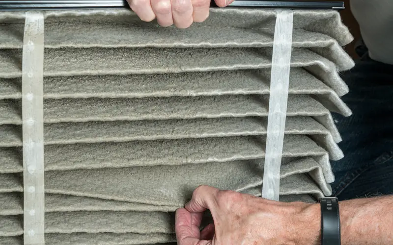 HVAC tech showing a dirty filter